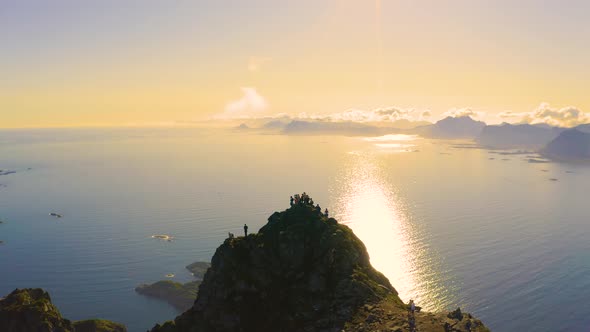 Flying Around Mount Festvagtinden with Tourists at the Top in Lofoten Norway