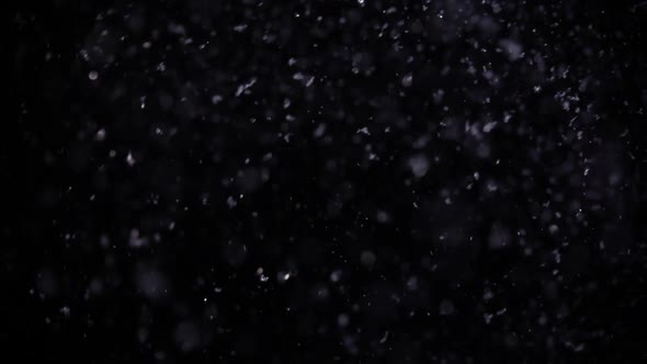 Blurred Snowflakes Falling at Night