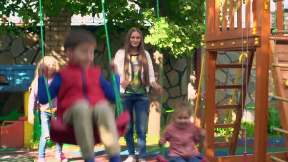 Family in Backyard Playground  alt