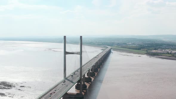 Dolly back drone shot from Prince of wales suspension bridge Severn estuary