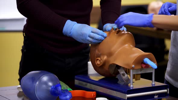 Dummy head and intubation set for advance cardiac life support training. 