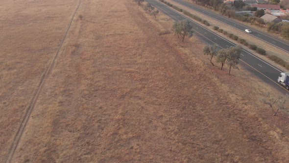 AERIAL shot over a busy national road