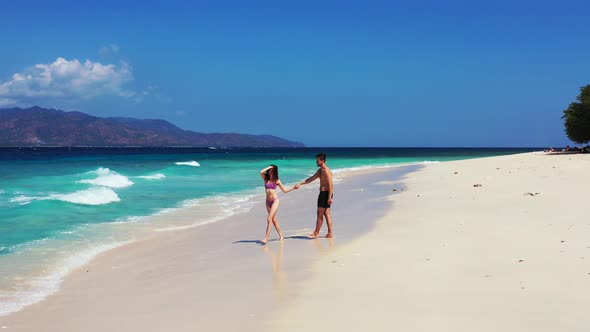 Young Couple on Romantic Honeymoon Live the Dream on Beach on Summer White Sandy