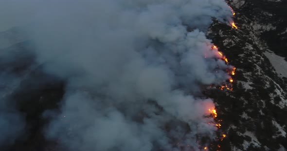 Aerial Panoramic View of a Forest Fire at Night Heavy Smoke Causes Air Pollution and Fire in Full