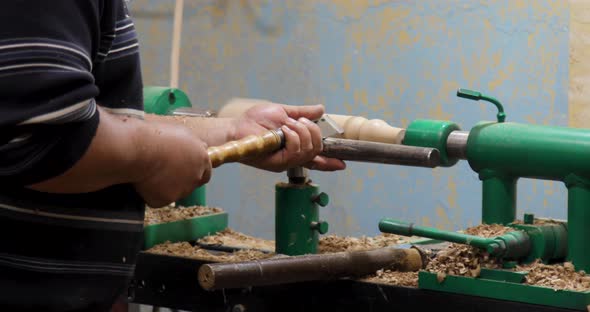 Carpenter turning wood on a lathe