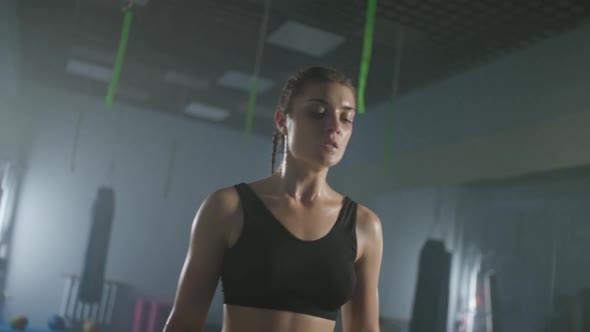 Portrait of a Tired Woman Fighter Raises His Hands Young Female Recovers After a Hard Workout in the