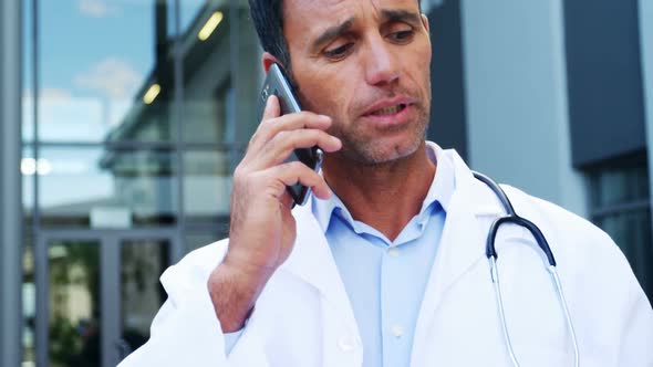 Doctor talking on mobile phone