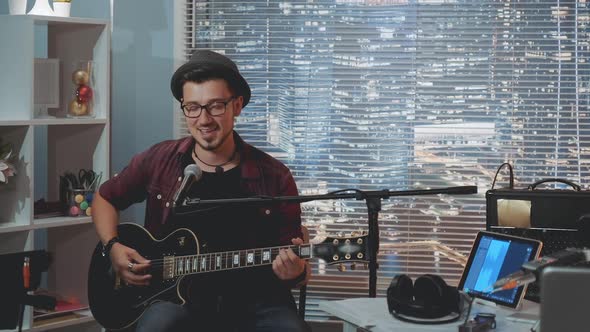 Talented Hipster Recording His New Track in Home Studio