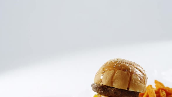 Hamburger and french fries on table