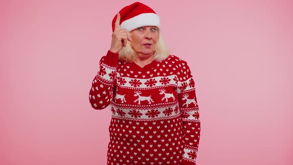 Grandmother in Christmas Sweater Make Gesture Raises Finger Came Up with Creative Plan Good Idea