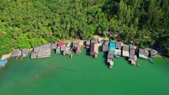 Aerial shot of local fisherman village beside the sea