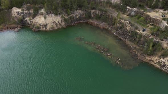 Aerial Drone View Basalt Columns on Emerald Lake in a Flooded Quarry