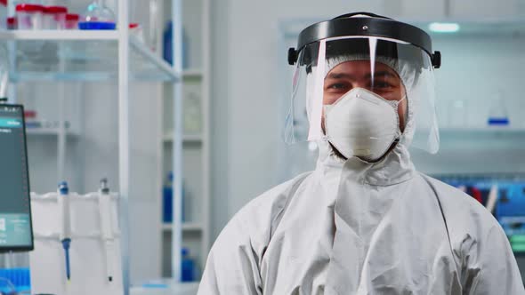 Scientist Man Wearing Coverall Smiling at Camera