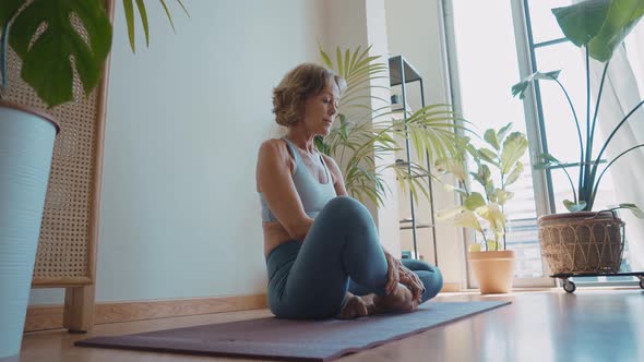 Woman doing yoga at home