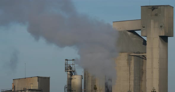 Smoke and air pollution from a incinerator chimney near Caen, Normandy, France.