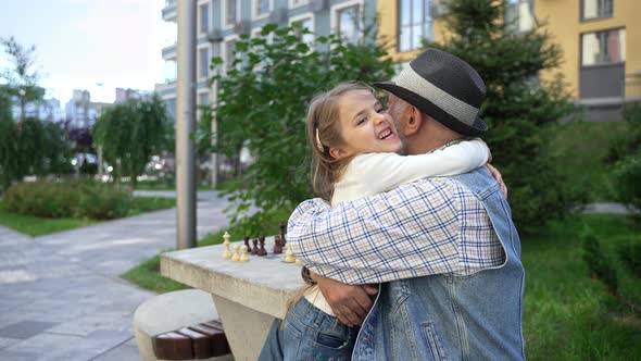 Lovely Exited Little Girl Hugs Her Caring Grandpa