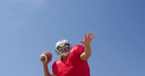  American football player throwing a ball