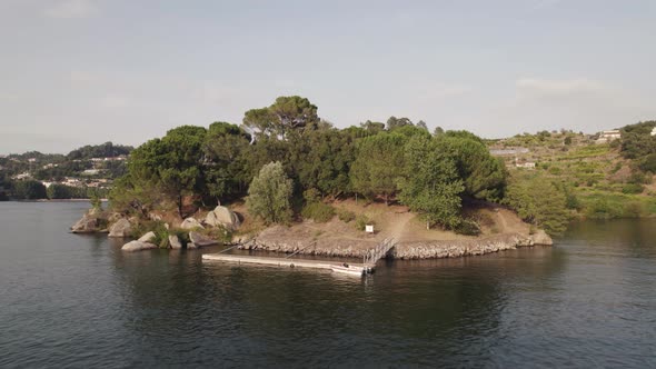 Wooden pier at Ilha dos Amores or love Island in middle of river, Castelo de Paiva in Portugal.