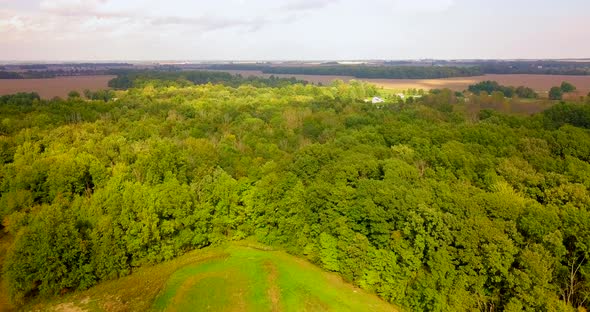 4K aerial footage of a field, forest, and farmland in Ohio