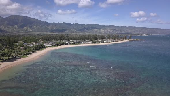 Aerial view of Haleʻiwa beachfront homes in Oahu Hawaii on a sunny day