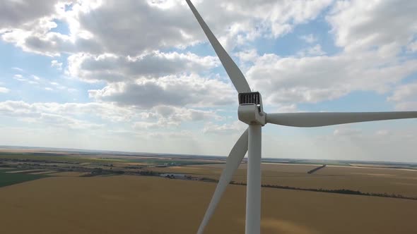 Wind Mill Producing Electricity From Wind Rear View. Aerial Survey. Close Up