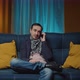 Guy Relax on Comfy Sofa Hold Mobile Phone Close to Ear Talk to Friend Share News Discuss Affairs - VideoHive Item for Sale