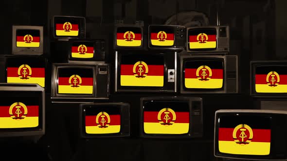 Flag of East Germany Displayed on Old Stacked TVs