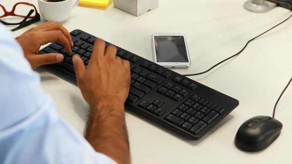 Male executive working on computer