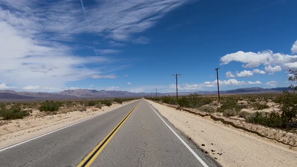 Driving Down the Endless Desert Road. Adventure Travel in a Desert.