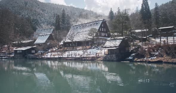 Traditional Japanese Village Near the Lake, Spring Time with Snow Covered Buildings, Hida Folk