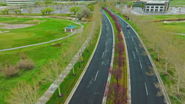 Increíble Aerial Revealing Beautiful Path of Trees on Top Lake Park Boulevard in West Valley City Ut