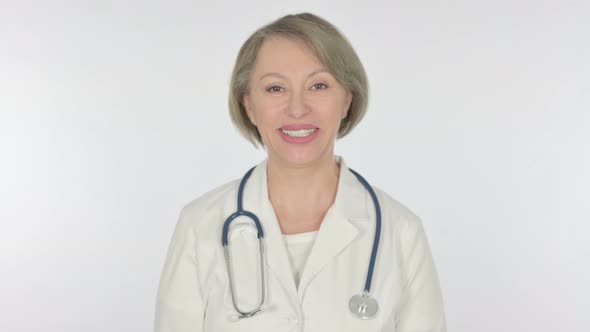 Smiling Old Female Doctor on White Background