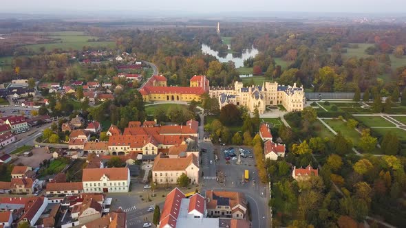 Aerial view of small town and green gardens in Lednice castle Chateau yard in Moravia, Czech