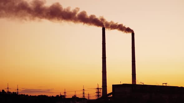 Silhouette of the power plant at sunset