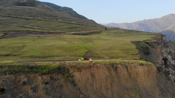 Aerial View of Tourists Who Wake Up and Meet the Sunrise on Rock in Dagestan