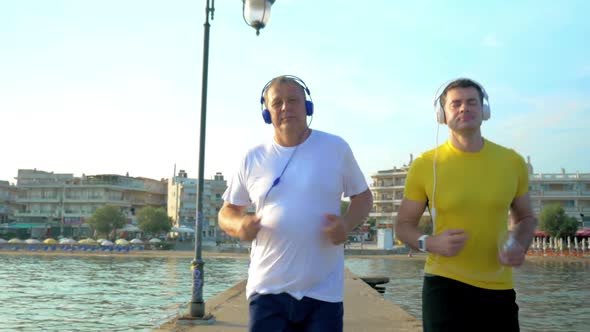 Man Checking Smart Watch During Morning Jogging