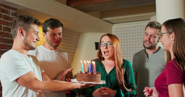 Group of Friend Surpise Beautiful Woman for Her Birthday and Celebrate Together at City Pub