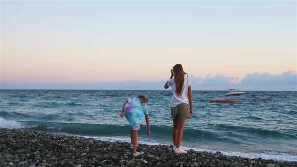 Little Happy Funny Girls Have a Lot of Fun at Tropical Beach Playing Together.