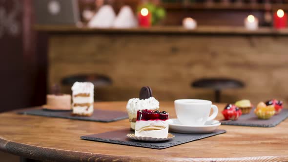 Dolly Parallax Shot on Coffee and Slices of Cakes on a Table