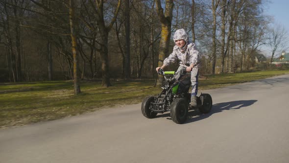 Boy Riding Electric Quad Bike