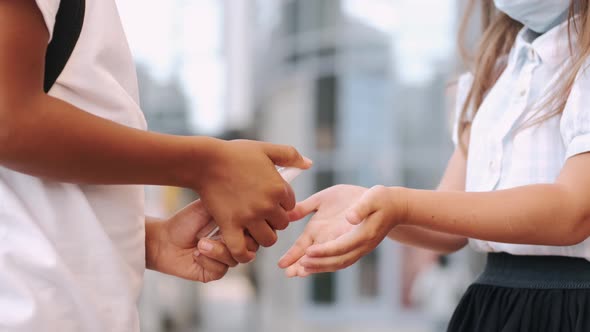 Schoolkids Disinfecting Hands During Coronavirus Pandemic