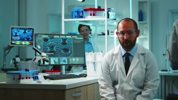 Tired Doctor with Glasses Looking Exhausted at Camera