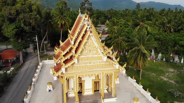 Classic Buddhist Temple Between Forest. From Above Drone View Buddhist Monastery Between Green Trees