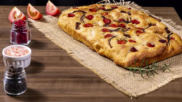 Traditional Italian Focaccia with pepperoni, cherry tomatoes, black olives, rosemary ando onion - ho