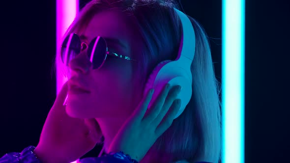 Portrait Young Stylish Woman Sunglasses Big White Headphones Dances Enjoys Slow Music
