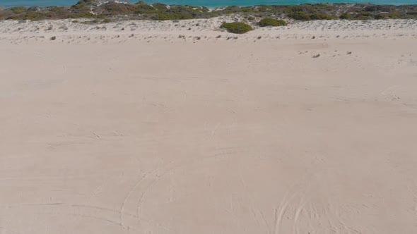 Flying over Lancelin Sand Dunes revealing the Ocean Aerial Drone Shot