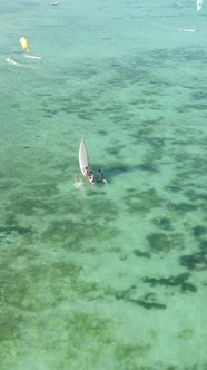 Boat Boats in the Ocean Near the Coast of Zanzibar Tanzania Slow Motion Vertical Video