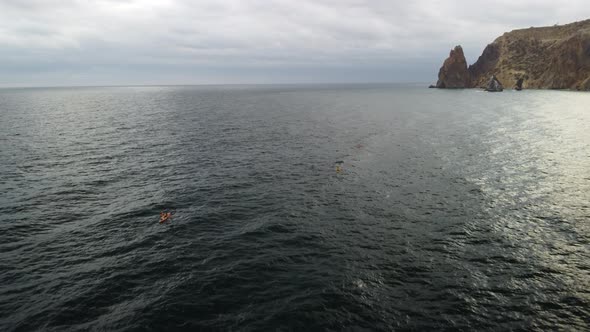 Aerial View From Above on Calm Azure Sea and Volcanic Rocky Shores