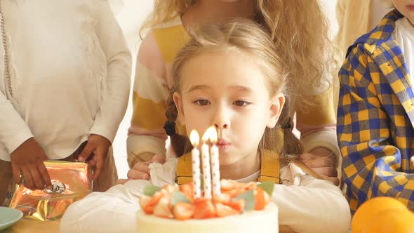 Cute European Girl Celebrates Her Birthday Blows Out Candles Surrounded By Her Children