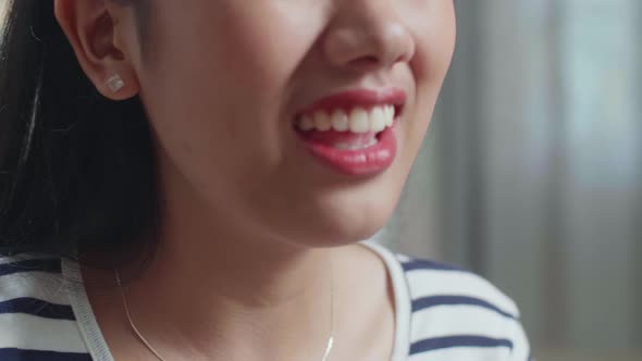 Close Up Of Asian Woman Singing Song At Home